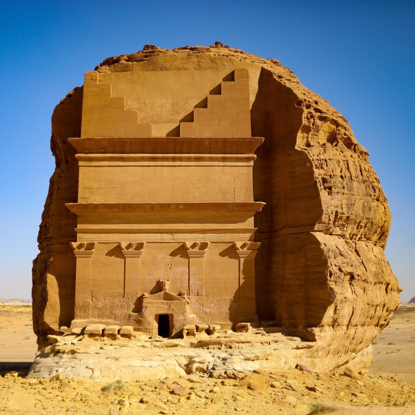 A fomous tomb in Saudi Arabia called 'The Lonely Castle' which is a carved tomb in the rockface